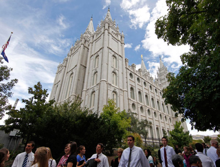 People stand outside the Salt Lake Mormon temple as they wait in line to attend the fifth session of the 181st Semiannual General Conference of the Church of Jesus Christ of Latter-day Saints in Salt Lake City, Utah October 2, 2011.