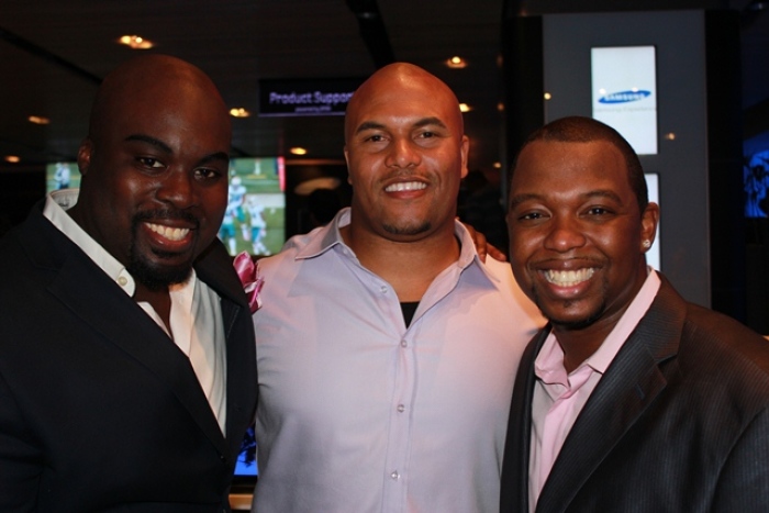 TR Luxury Group pictured with former NY Giant Antonio Pierce (center)