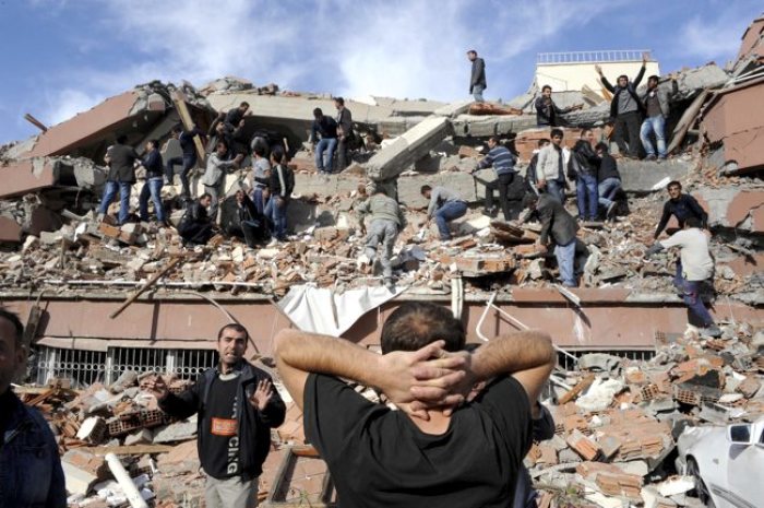 Rescue workers try to save people trapped under debris after an earthquake in Tabanli village near the eastern Turkish city of Van on Oct. 23, 2011.