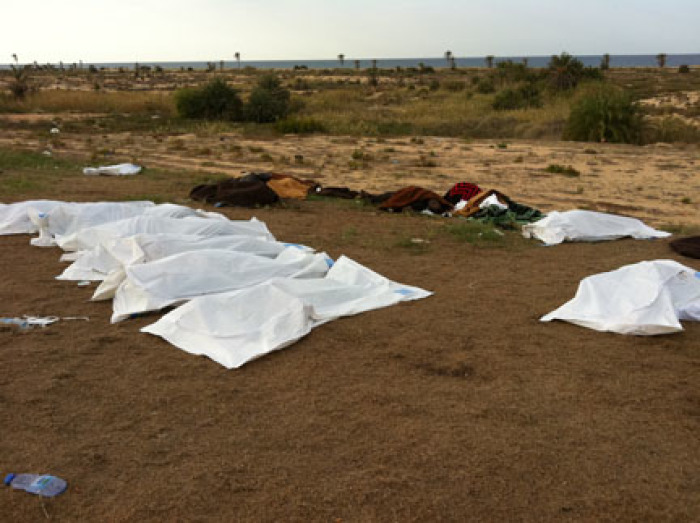 Bodies of persons lie in the garden of the Mahari Hotel in Sirte, immediately after they were put into body bags by local residents. At the time of their killing the hotel was apparently controlled by anti-Gaddafi fighters from Misrata. 53 persons were apparently executed at the site.