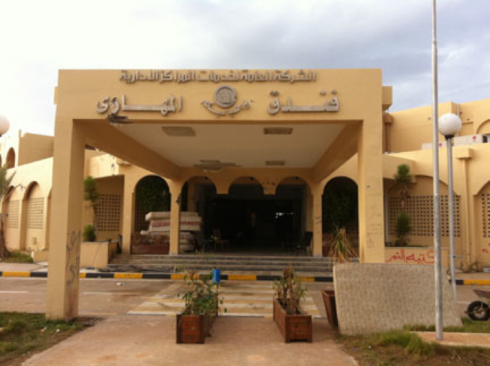 The entrance to the Mahari Hotel in Sirte, where at least 53 persons were apparently executed. At the time of their killing the hotel was apparently controlled by anti-Gaddafi fighters from Misrata. The red graffiti on the left states 'Tiger Brigade,' the name of a prominent Misrata fighting group.