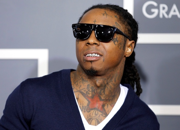 Lil Wayne poses on arrival at the 53rd annual Grammy Awards in Los Angeles