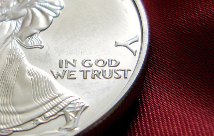 The national motto, 'In God we trust,' on U.S. currency.