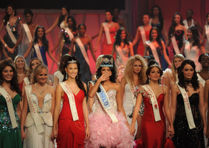 Miss Venezuela, Ivian Sarcos (4th L), joins other contestants on stage after being crowned Miss World 2011 in Earls Court in west London November 6, 2011.