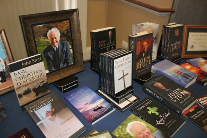 John Stott's books and framed photos are on display at the reception following the U.S. memorial service at College Church in Wheaton, Illinois, on Friday, November 11, 2011.