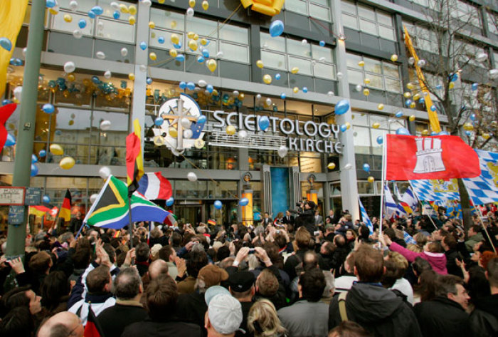 Members await the opening of the new office of the Scientology Church in Berlin January 13, 2007