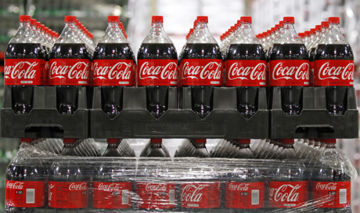 Bottles of Coca-Cola are seen in a warehouse at the Swire Coca-Cola facility in Draper, Utah March 9, 2011.