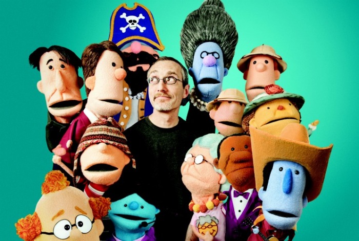 Phil Vischer, creator of 'VeggieTales,' poses with the puppets of his latest creation 'Buck Denver Asks... What's in the Bible?'
