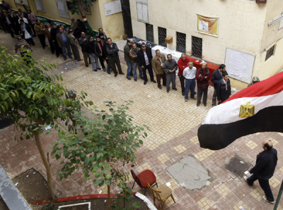 People queue outside a polling station in Cairo November 28, 2011.