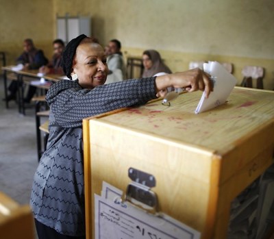 A woman casts her vote at a polling station during parliamentary elections in Cairo, Egypt on Nov. 28, 2011.