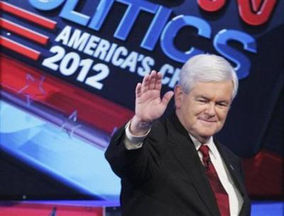 Republican presidential candidate former U.S. House Speaker Newt Gingrich (R-GA) takes the stage upon arriving at the CNN GOP National Security debate in Washington, November 22, 2011.