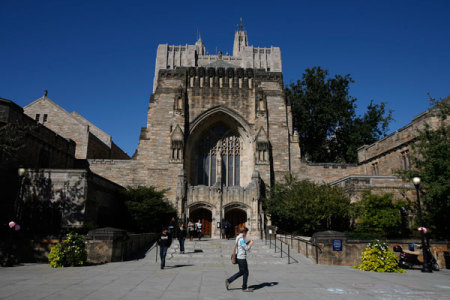 Students walk on the campus of Yale University in New Haven, Connecticut, October 7, 2009.