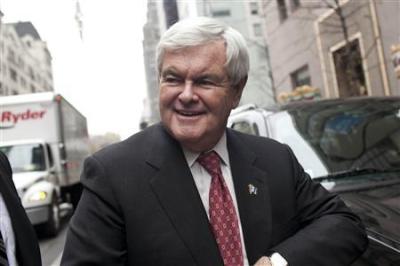 Republican presidential candidate Newt Gingrich walks into Trump Towers for a meeting with real estate investor Donald Trump on 5th Avenue in New York December 5, 2011.