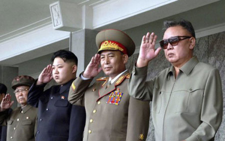 North Korean leader Kim Jong-il (R) and his son Kim Jong Un (2nd L) salute as they watch soldiers attending a military parade in the Kim Il Sung square in Pyongyang in this September 9, 2011 file photo, marking the 63rd anniversary of the state's founding. North Korean leader Kim Jong-il died on a train trip, state television reported on December 19, 2011.