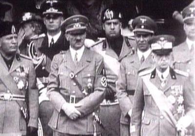 King Victor Emanuel III, (R) Adolf Hitler (C) and Benito Mussolini (L) watch fascist troops march past from a balcony in central Rome in this 1941 television file footage.