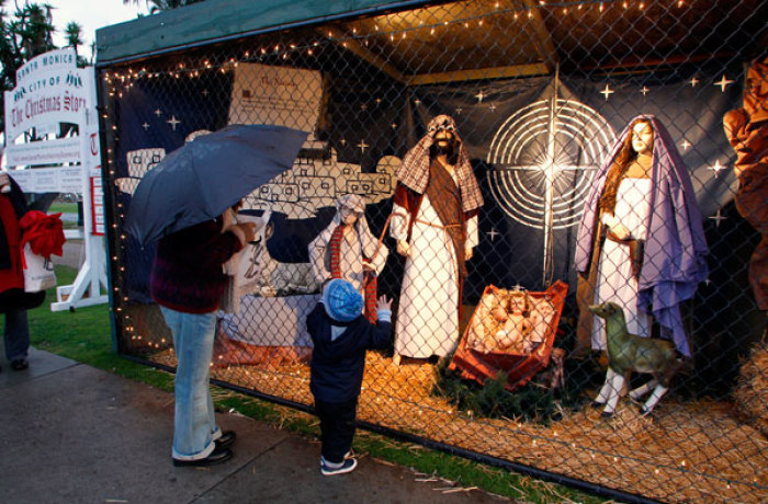 Two-year-old Ruben Lucas of Australia and his great grandmother Dot Brown look at a display showing the nativity scene in Palisades Park in Santa Monica, California December 12, 2011. Due to a city lottery system to fairly allocate available spots in the park for displays, atheists have been able to claim display spaces usually used for the nativity scene to display different items, according to local media.