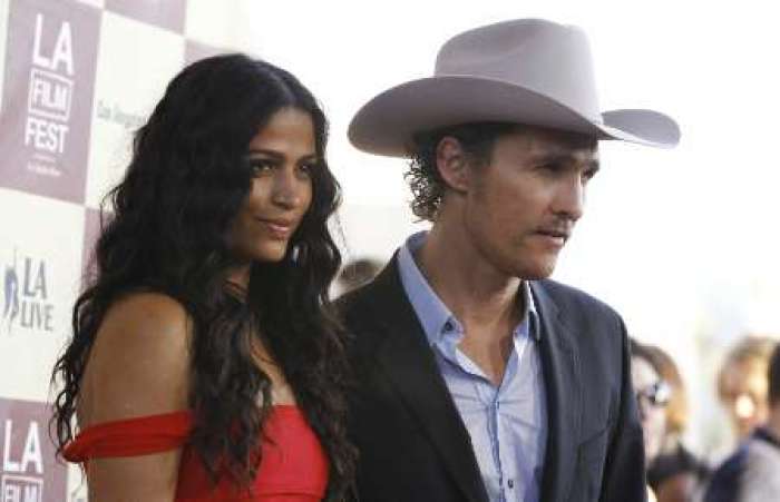 Cast member Matthew McConaughey and his partner Camila Alves pose at the world premiere of 'Bernie' during the opening night of the Los Angeles Film Festival at the Regal Cinemas in Los Angeles June 16, 2011. The movie opens in the U.S. on June 16.