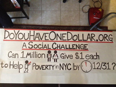 A banner for the Do You Have One Dollar Times Square initiative is seen here.
