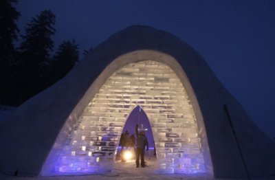 A worker makes final touches at an entrance at a Catholic church made of snow in the Bavarian village of Mitterfirmiansreut, near the German-Czech border, December 28, 2011. The snow church is likely to become a tourist attraction till the beginning of spring.