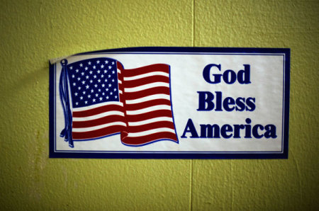 A decal reading "God Bless America" is seen on the wall of the soup kitchen in the basement of the St. Leo Catholic Church in Detroit December 17, 2011.