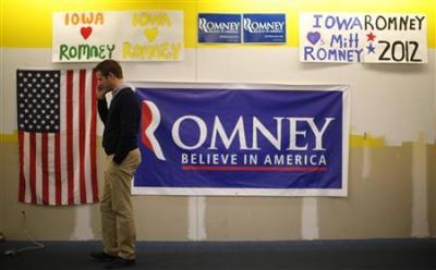 A Mitt Romney supporter telephones potential voters to get their support from their campaign office in Des Moines, Iowa January 1, 2012.