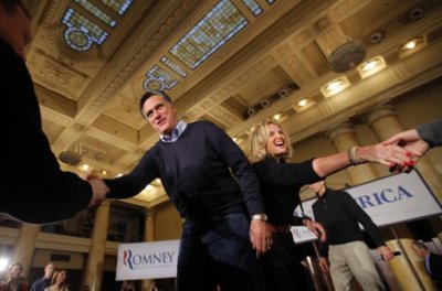 Republican presidential candidate and former Massachusetts Governor Mitt Romney (L) and his wife Ann greet audience members at a campaign rally in Des Moines, Iowa January 3, 2012, the day of the Iowa caucus.