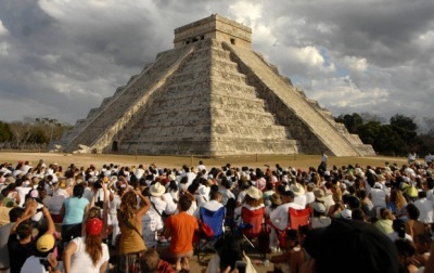 People look at the strip of light on the sculpture of a serpent on the north (left) side of the Mayan pyramid El Castillo (The Castle), in Chichen Itza, in the southern state of Yucatan, Mexico.