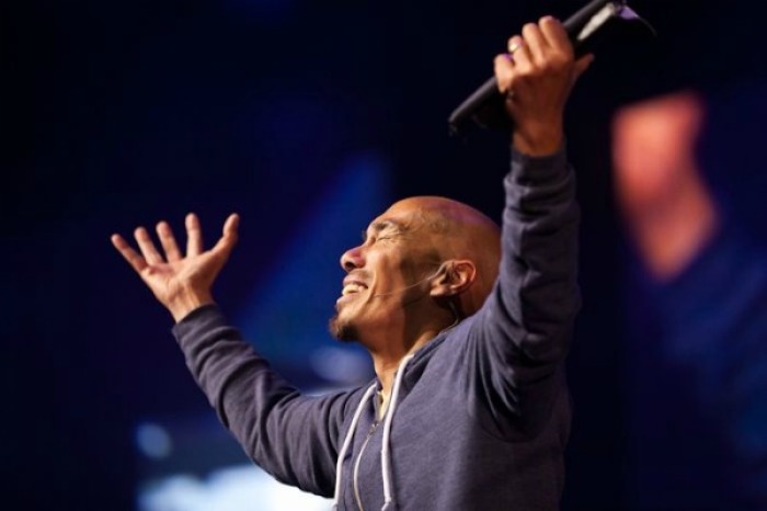 Francis Chan speaks to students at the Georgia Dome in Atlanta during the Passion 2012 conference on Jan. 4, 2012.