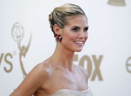 Model and host Heidi Klum from television "Project Runway" arrives at the 63rd Primetime Emmy Awards in Los Angeles September 18, 2011.