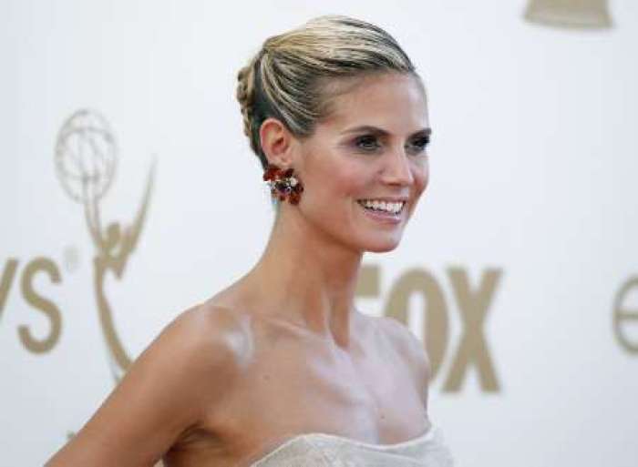 Model and host Heidi Klum from television 'Project Runway' arrives at the 63rd Primetime Emmy Awards in Los Angeles September 18, 2011.