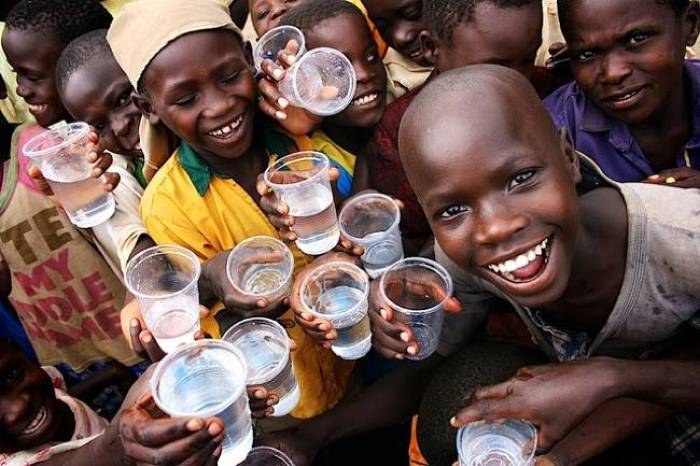 Children in Uganda enjoy the gift of safe drinking water in this undated photo.