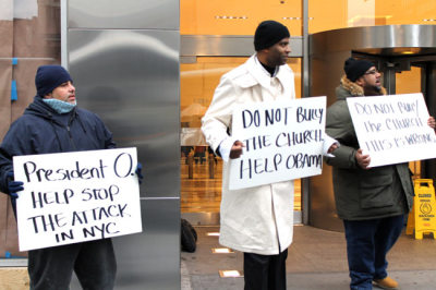 Dimas Salaberrios (C), pastor of Infinity Church in the Bronx borough of New York City, protests with supporters outside of the offices of the New York City Law Department in downtown Manhattan Jan. 5, 2012. Salaberrios and supporters were speaking out against his church's eviction from property owned by the New York City Housing Authority used for worship purposes.