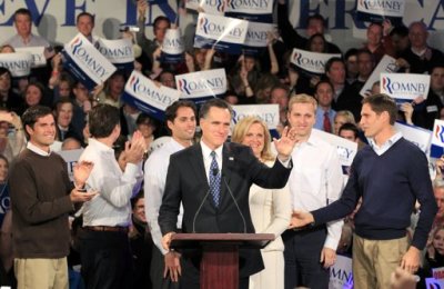 Republican presidential candidate and former Massachusetts Governor Mitt Romney is surrounded by his wife Ann and their sons as he addresses supporters at his New Hampshire primary night rally in Manchester, New Hampshire, January 10, 2012.