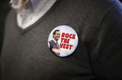 A supporter of presidential candidate and former Pennsylvania Senator Rick Santorum wears a campaign button featuring his picture and wearing his trademark vest, at Santorum's Charleston campaign headquarters in South Carolina January 14, 2012. The South Carolina Primary will be held on January 21.