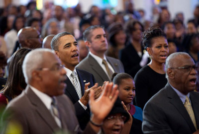 President Barack Obama, First Lady Michelle Obama, and daughters Malia (partially seen at left) and Sasha attend church services at Zion Baptist Church in Washington, D.C., Sunday, Jan. 15, 2012.
