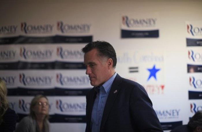 U.S. Republican presidential candidate and former Massachusetts Governor Mitt Romney visits his campaign headquarters in Charleston, South Carolina, January 19, 2012.