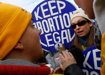 Pro-life and pro-choice supporters square off in an argument during a demonstration marking the anniversary of the Supreme Court's 1973 Roe v. Wade abortion decision in Washington, D.C. Jan. 24, 2011.