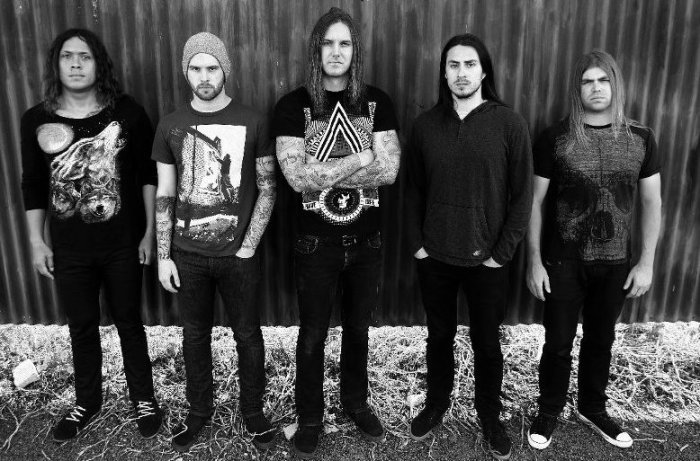 Timothy Lambesis (center), the frontman of heavy metal Christian band, As I Lay Dying, plead guilty on Feb. 25, 2014 for hiring a hitman to kill his wife.