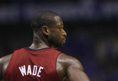 Miami Heat's Dwyane Wade pauses during a break in play against the Dallas Mavericks during Game 3 of the NBA Finals series in Dallas, Texas on June 5, 2011.