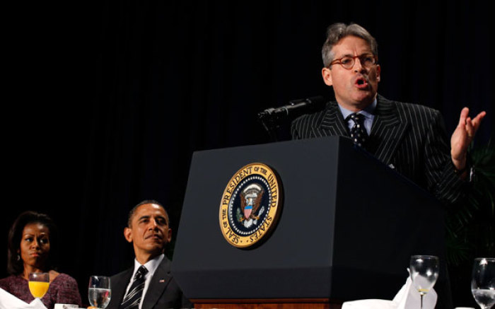 U.S. President Barack Obama and first lady Michelle Obama listen to author Eric Metaxas (R) deliver the keynote message at the 60th annual National Prayer Breakfast at the Washington Hilton hotel in Washington February 2, 2012.