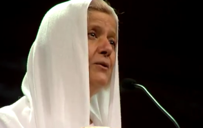 'Mama Maggie' Gobran is seen speaking to the audience at Willow Creek's 16th annual Leadership Summit in 2001. 