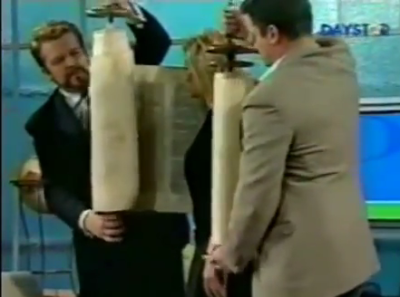 Paula White is seen on the air of her show, 'Paula White Today,' wrapped in 'sacred' scroll in a ritual performed on multiple occasions by television personality Rabbi Ralph Messer. The clip was submitted to YouTube originally by an unidentified source.
