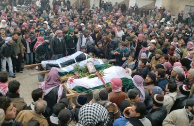 Anti-government demonstrators attend the funeral of people whom they said were killed during clashes with government troops in earlier protests against Syria's President Bashar Al-Assad, in Marat al-Numan near the northern province of Idlib February 6, 2012. Picture taken February 6, 2012.