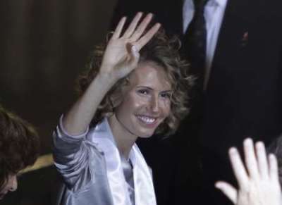 Syria's First Lady Asma al-Assad waves as she attends the opening ceremony for the 7th Special Olympics Middle East/North Africa (SOMENA) Regional Games in Damascus September 25, 2010.