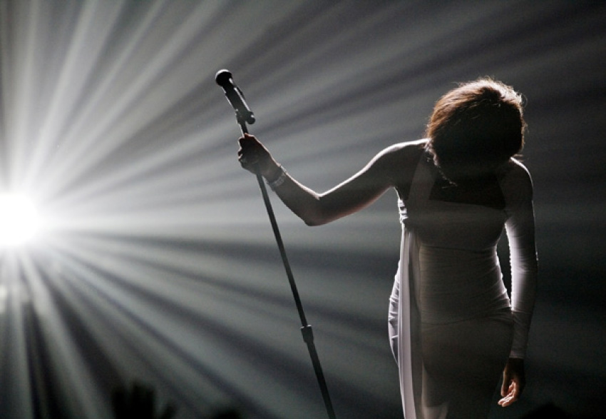 Whitney Houston bows after performing