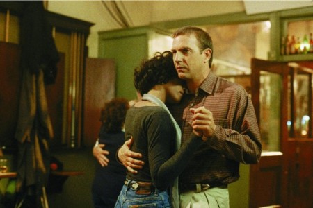 Whitney Houston and Kevin Costner dance in a scene from their 1992 film "The Bodyguard," in this undated publicity photograph released to Reuters Feb. 11, 2012.
