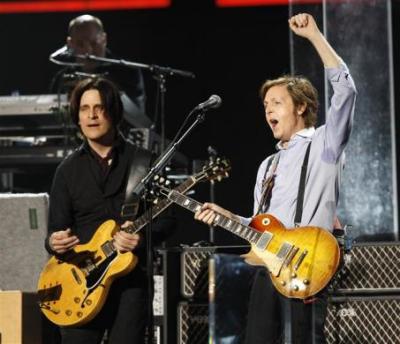 Paul McCartney (R) performs at the 54th annual Grammy Awards in Los Angeles, California February 12, 2012.