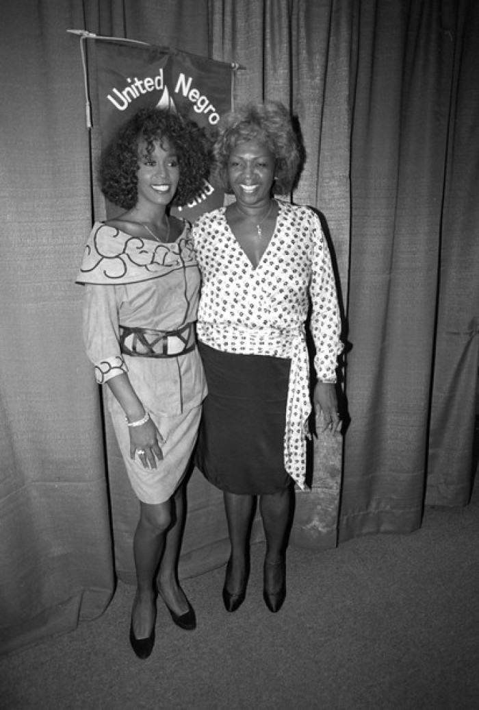 Singer Whitney Houston is seen with her mother, Cissy Houston (R), at a news conference in New York City, in this July 11, 1988 file photo.