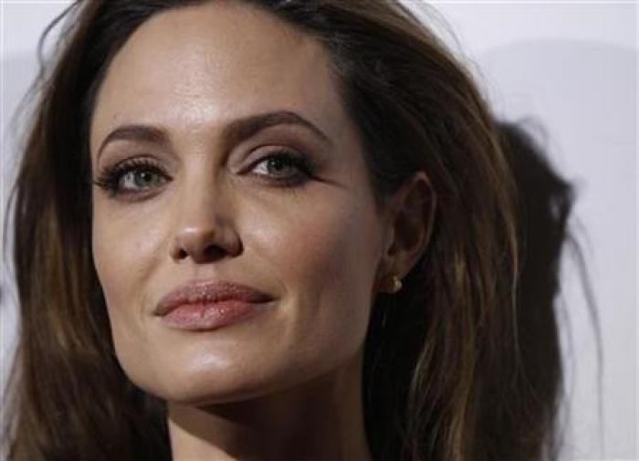 Director of the movie Angelina Jolie poses at the premiere of ''In the Land of Blood and Honey'' at the Arclight theatre in Los Angeles, Calif., Dec. 8, 2011.