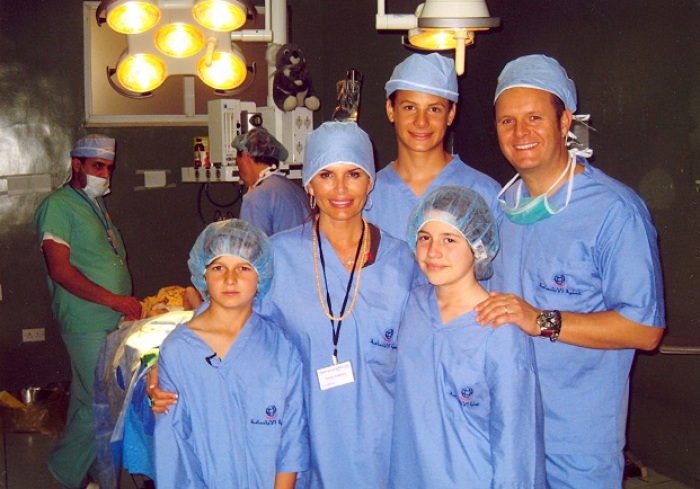 Roma Downey and husband Mark Burnett and family participate in an Operation Smile surgery.